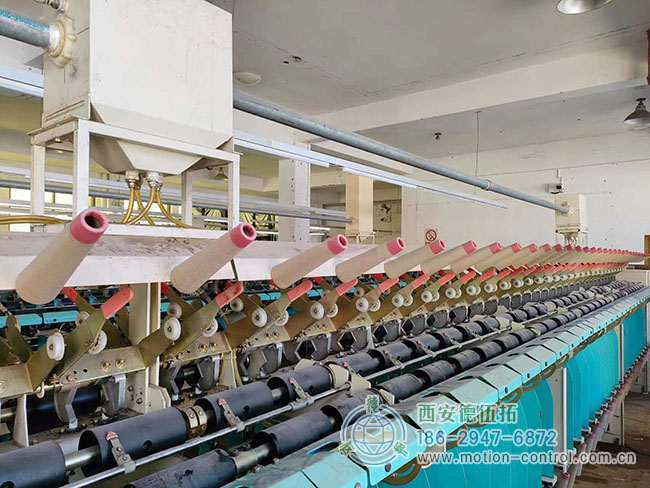 图为由编码器调节张力的关纱机照片